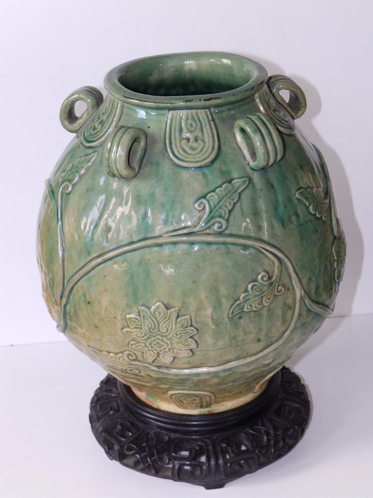 A Chinese provincial celadon glazed jar, of rounded form with five small loop handles, applied - Image 2 of 4