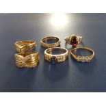 A small three stone illusion set diamond ring and five other dress rings - two a/f. (6)