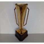 A modern Irish silver-gilt horse racing trophy in the art deco style, of plain tapering triangular