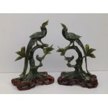 A pair of 20thC Chinese spinach soapstone carvings, each depicting two birds perched on leafy