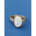 An opal & diamond set 750 yellow metal ring. Finger size N/O.