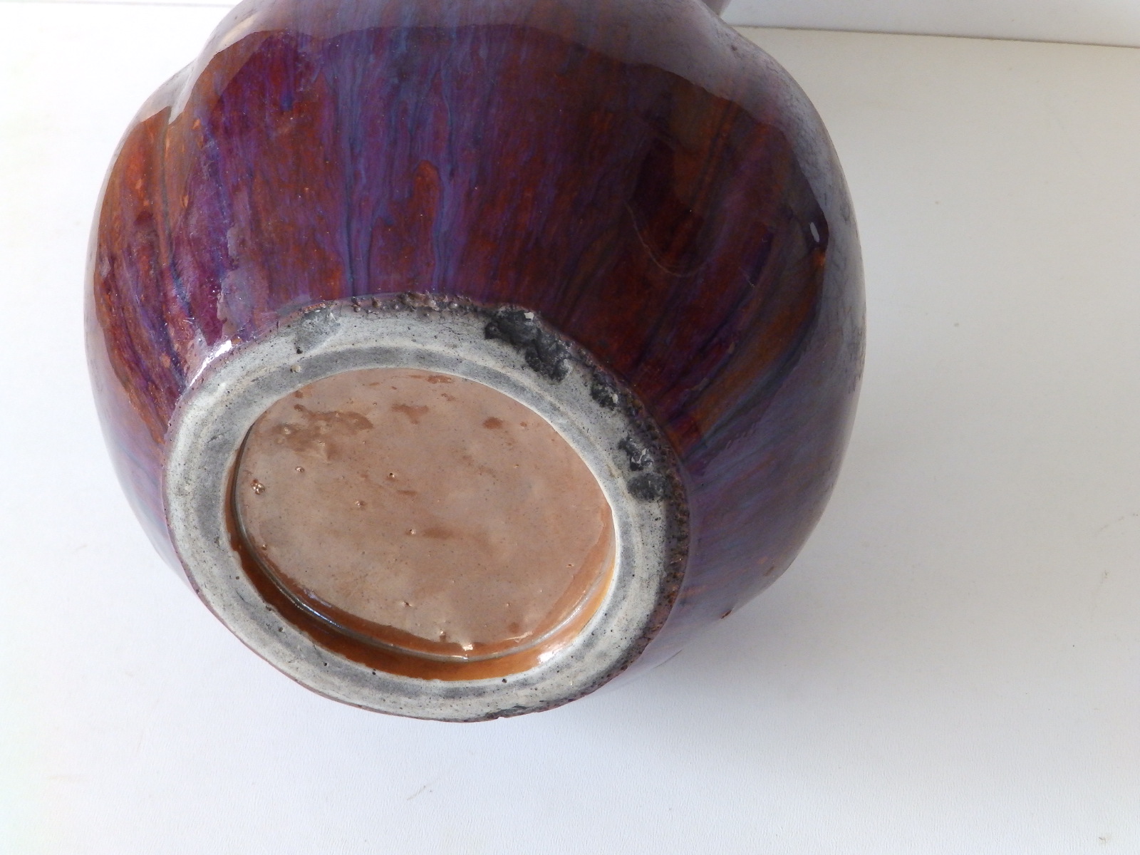 A thickly potted Chinese Sang de Boeuf porcelain bottle vase, decorated in red & purple, the body - Image 4 of 4