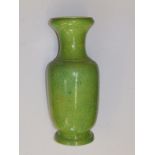 A Chinese powder green glazed vase with blue interior of rouleau shape with flared rims, four