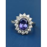 An tanzanite & diamond oval cluster ring, the tanzanite weighing approximately 2.25 carats , on 18ct