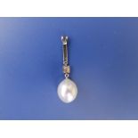An Edwardian pearl & diamond set gold pendant, the pearl 12mm length,