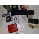An Order of St John four coin proof set in case, a cased four coin South Arabian Proof Set, a