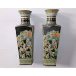 A large pair of Chinese famille noir porcelain vases, of tapering square section with waisted necks,