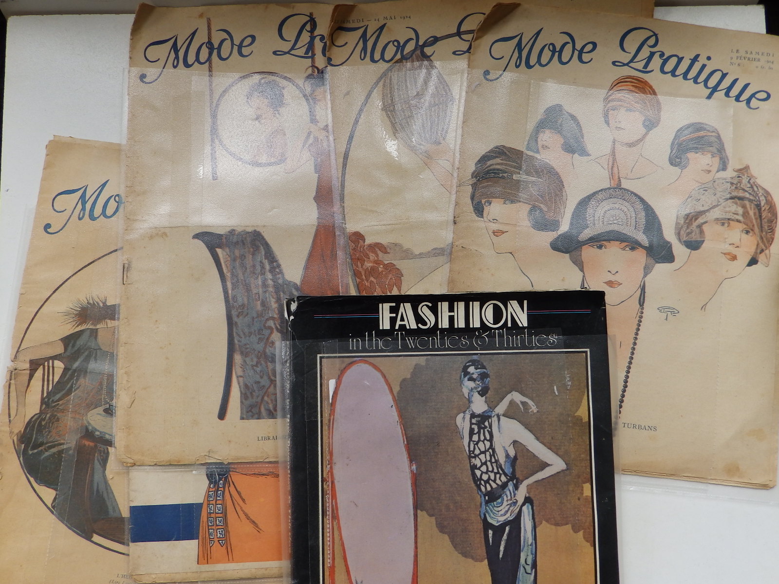 Five 1920's French fashion magazines and a book - 'Fashion in the Twenties & Thirties'. (6)