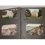 An old album containing approximately 100 postcards, together with an album containing approximately