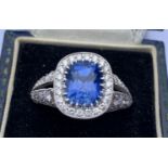 A certified natural colour change 3.52 carat Sri-Lankan sapphire & diamond cluster ring, the