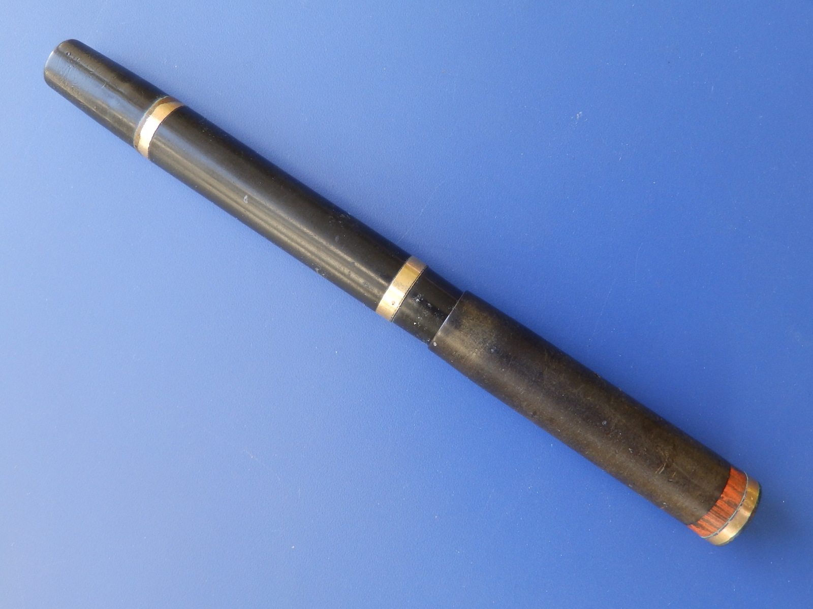 A Swan Mable Todd & Co. brown bakelite fountain pen with yellow metal bands to case - a/f.