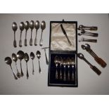 A set of six silver fiddle pattern teaspoons - Walker & Hall, London 1910 - one bowl a/f, 11 other