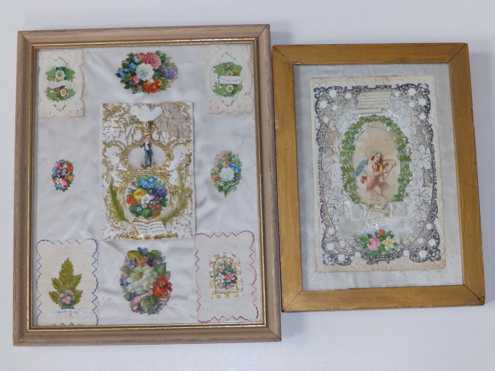 Two small framed displays of Victorian Valentine cards.