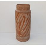 A Neolithic period Chinese terracotta pottery vase of cylinder shape, the sides decorated with