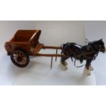 A brown Beswick shire horse with wooden cart.