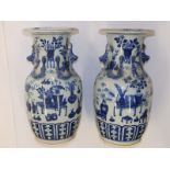 A pair of 19thC Chinese blue & white porcelain vases, the flared rims onto shouldered bodies, each
