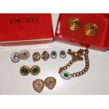 A boxed pair of large Escada gilt layered disc earrings, a pair of Butler & Wilson heart shaped