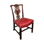 An 18thC mahogany dining chair in the Chippendale manner, the serpentine cresting rail with a