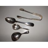 An Irish fiddle pattern silver dessert spoon - Dublin 1807, a pair of Exeter silver sugar tongs -