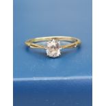 An old cushion cut diamond solitaire ring, the claw set stone weighing approximately 0.60 carat,