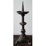 A Neo-Romanesque copper alloy pricket candlestick, 15" high.