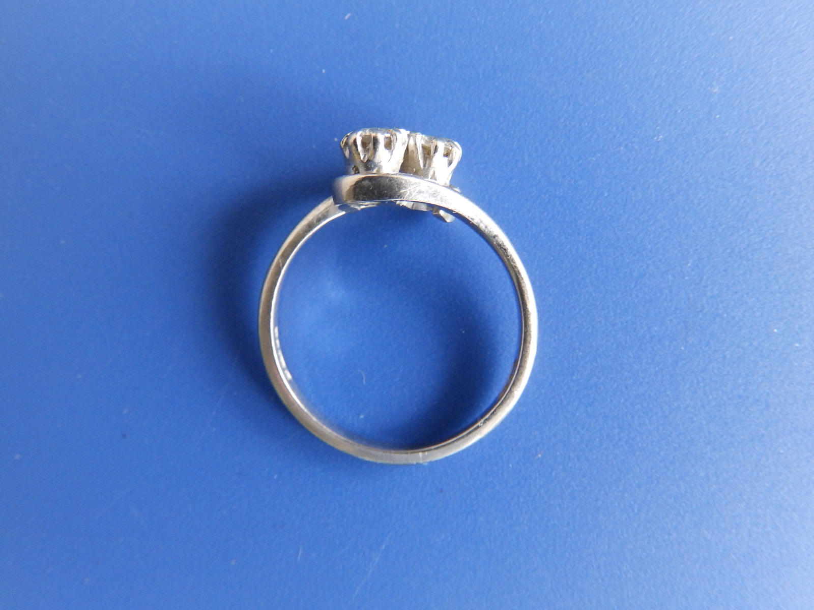 A small two stone diamond crossover set 18ct white gold ring. Finger size L. - Image 2 of 2