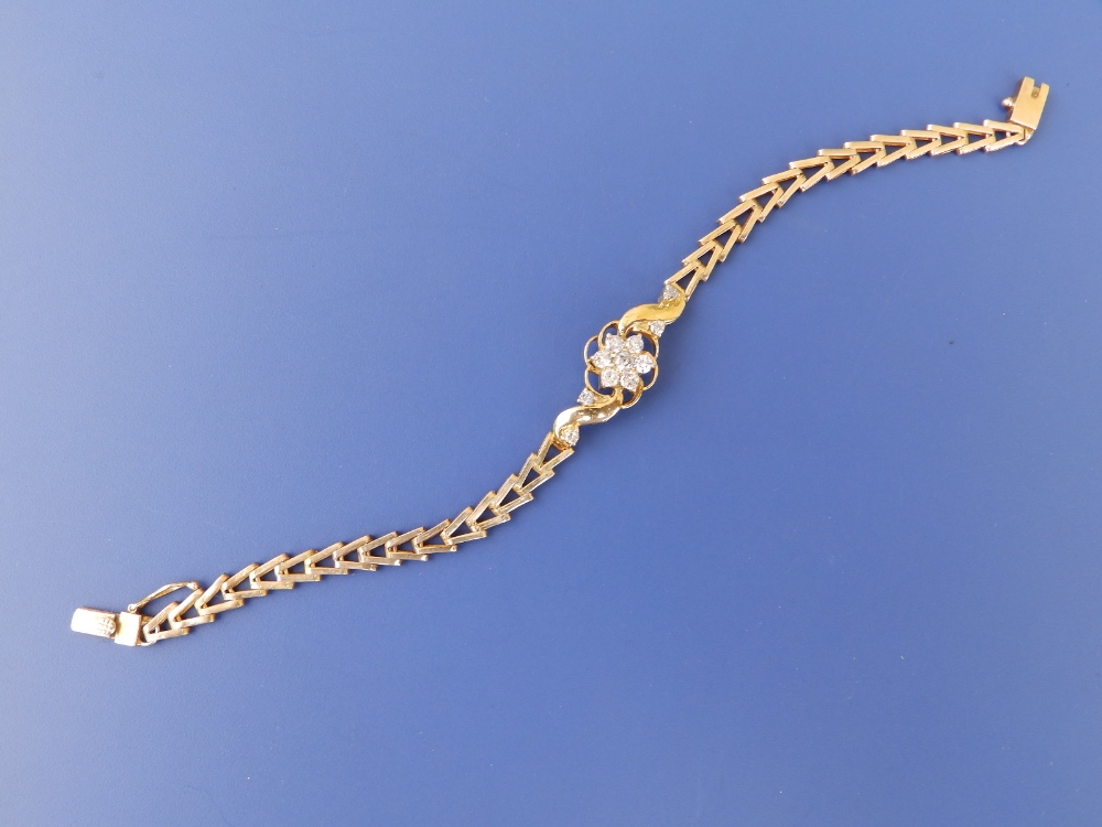 A yellow metal bracelet set with a diamond daisy cluster - tests as 18ct, 6.6" - Image 2 of 3