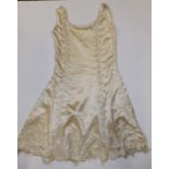 A 1920's beaded & diamonte flapper dress in cream silk with fringed hem.
