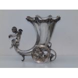A WMF cornucopia chariot vase, having two revolving wheels and being ridden by a cherub admiring a