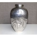 An Eastern silver vase of ovoid shape , having stylised flower & ribbon decoration, 6.5" high