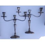 A pair of crested EP twin branch three-light candelabra in neoclassical style, converting to