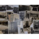 A collection of small WWII photographs depicting German troops, Hitler Youth and including snow