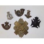 Six Victorian military badges.
