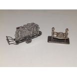 Two Dutch silver miniature models - a limonaire and orange sellers, the larger 3.5" across.