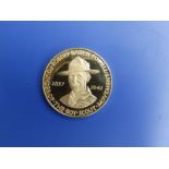 A cased gold medal commemorating the 25th Anninversary of the death of Lord Baden Powell, Type B,