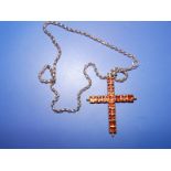 A yellow metal cross set with orange foil back stones , 2.1", together with a 9 carat gold belcher