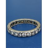 A diamond set 18ct white gold eternity ring. Finger size Q/R.