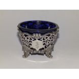A small early Victorian pierced circular silver sugar bowl by the Barnard Brothers with blue glass