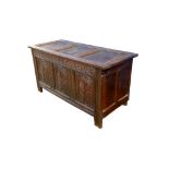 A late 17th/early 18thC carved oak three panel coffer, modified so that the top is fixed and the