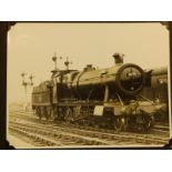 An album containing 42 20thC black & white photographs of steam trains, the majority 6" x 8", some