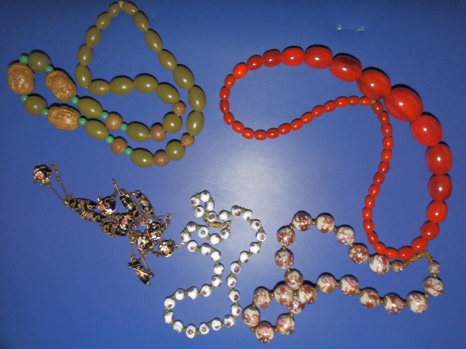 Three Venetian glass bead necklaces and two others. (5)