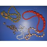 Three Venetian glass bead necklaces and two others. (5)