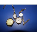An early 20thC Waltham yellow metal wrist watch without strap, one other and two ladies' yellow