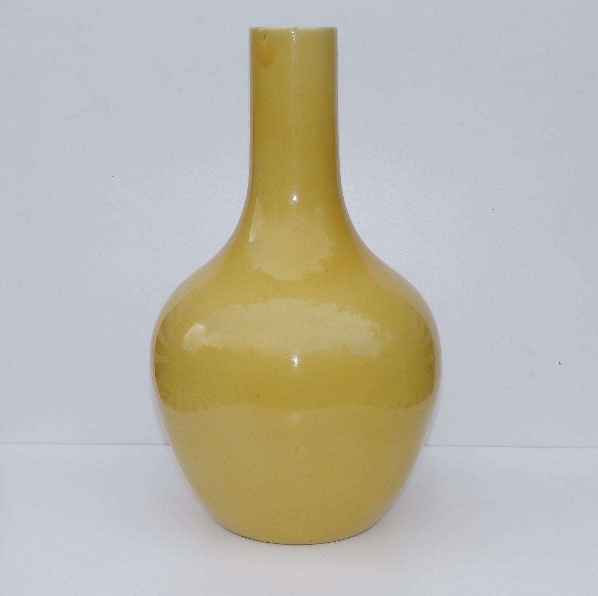 An 18thC Chinese Imperial yellow glazed porcelain bottle vase, 15.5" high - base drilled for use