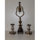 An old brass table lamp on dark marble base, 18" and a pair of dwarf EP candlesticks, 5.5". (3)