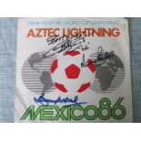 1986 WORLD CUP THEME RECORD COVER SIGNED BY BOBBY MOORE, GEOFF HURST & MARTIN PETERS