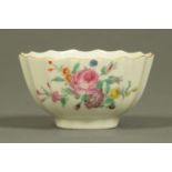 A Worcester fluted tea bowl, polychrome, decorated with floral bouquet and sprigs.