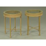 A pair of metal side tables, circular,