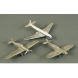 A Dinky toys Comet 702 Airliner, a model Hurricane and Spitfire.