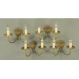 Four cast brass twin branch wall lights, late 20th century,